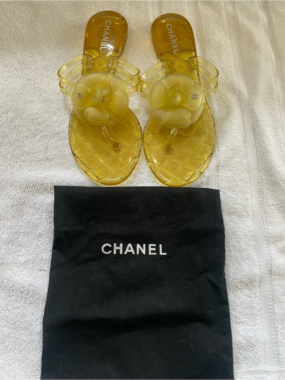 100% Authentic CHANEL Yellow Jelly Camellia Thong Sandals with Logo.
